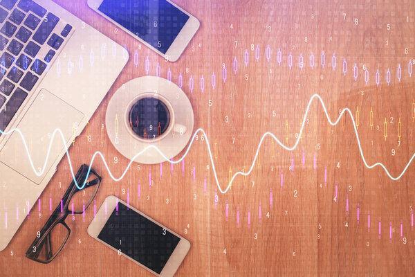 Multi exposure of financial chart hologram over desktop with phone. Top view. Mobile trade platform concept.