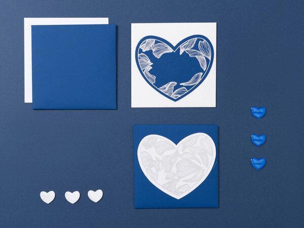 Blue, white and silver color mock-up of stationery, a template for brand identification on a gray and white background. For presentations and portfolio of graphic designers. Envelopes, piece of paperr hearts