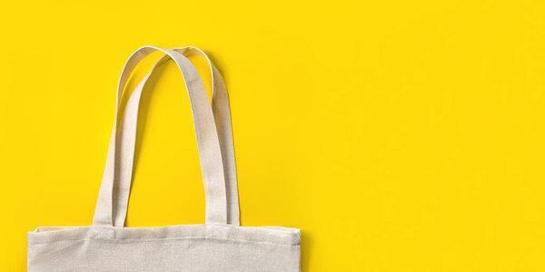 Fabric eco bag on blue background.