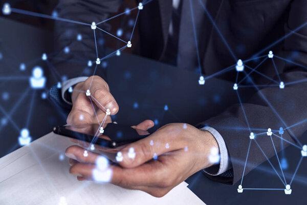 Hands of hr specialist browsing social networks in the Internet in smart phone to find the best candidates to hire international team. Concept of success. Media hologram icons. Formal wear.