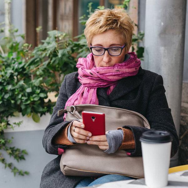 Adult woman surfing phone