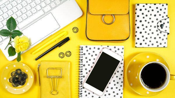 Desktop workspace with hi-tech laptop and modern colorful accessories.