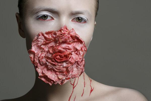 woman with red bloody flower