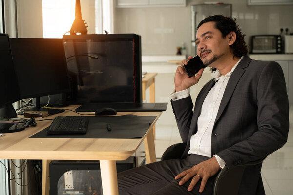 pakistani business man with a smartphone