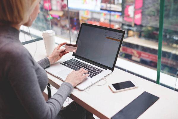  young hipster girl making online payment