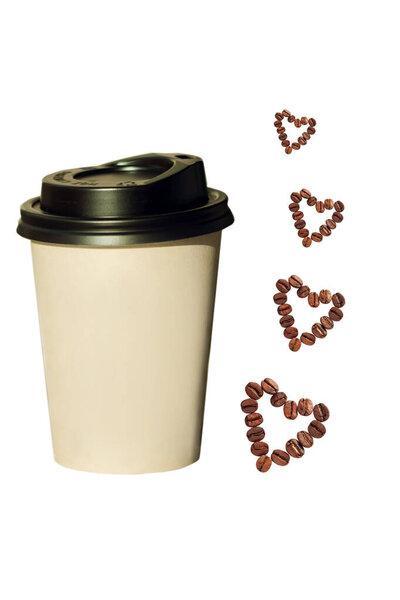 Paper cup with heartshaped coffee beans isolated on a white background.