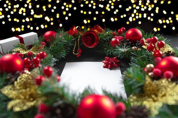 Letter to Santa and Christmas decorations on a dark background. Christmas and New Years Day letter, top view. Holiday layout with a letter mockup.