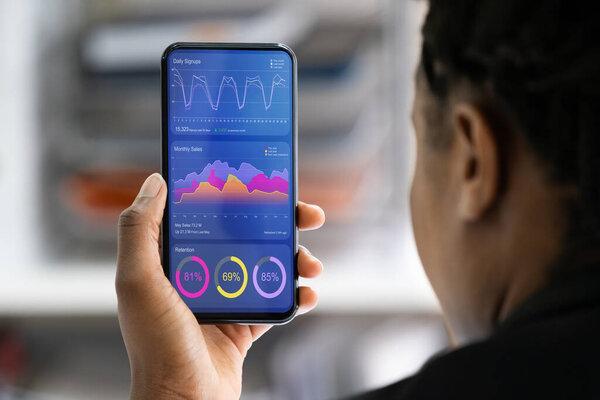 African American Financial Analyst Looking At Data On Data