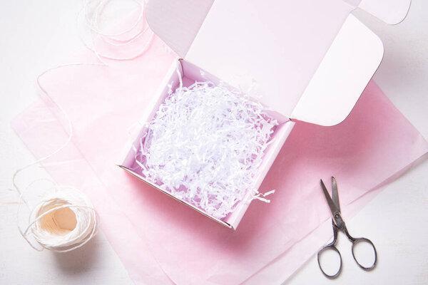Pink Cardboard Carton box on pink tissue paper