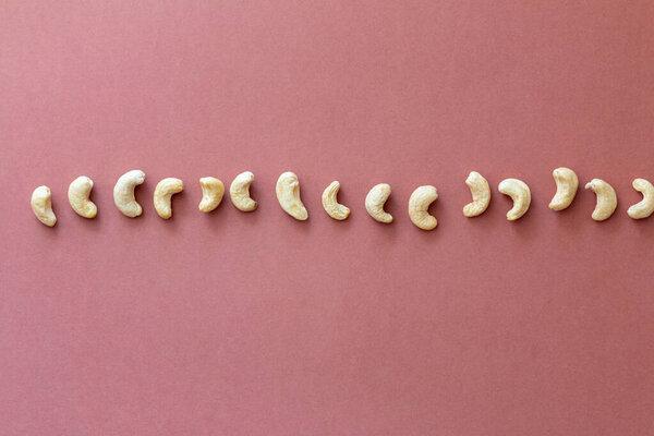 group of nuts on brown background, healthy food concept, empty space for text