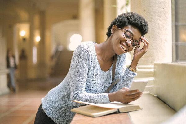 beautiful african american woman studying 