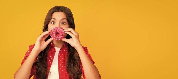 happy child having fun with sweet glazed donut, food.