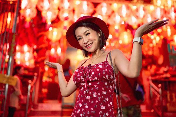 happy thai woman at temple in yaowarat china town bangkok during chinese new year