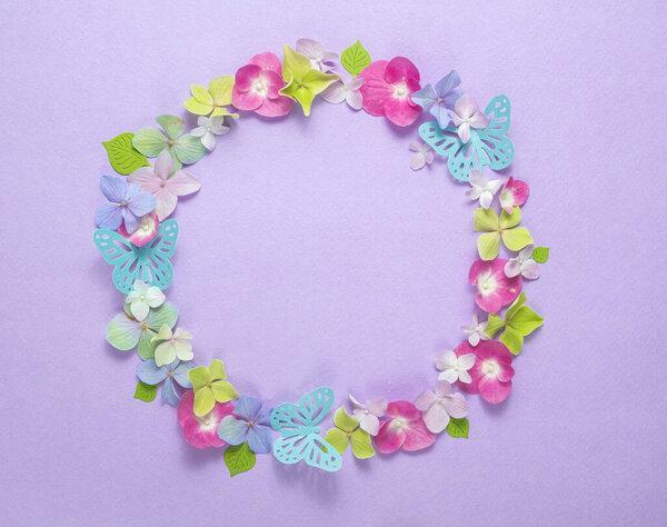 Flower composition. Wreath of pink, blue, white hydrangea flowers isolated on white background. Flat lay, top view, copy space 