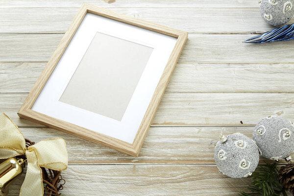 Christmas or new year 2019 concept background with copy space. Christmas empty photo frame and gift present boxes on white wooden background.