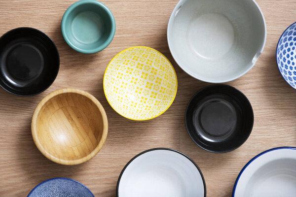 set of bowls of different colors seen from the top