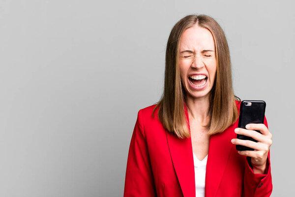 pretty caucasian businesswoman using a smartphone