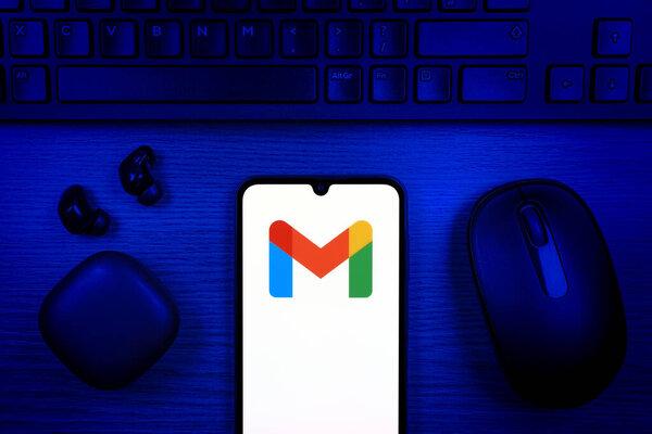 Prague, Czechia - 10 21 2024: Smartphone on surface showing Google Gmail logo.