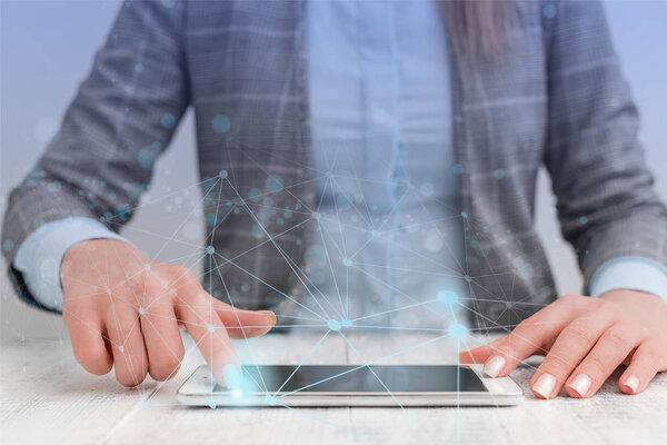 Female human presenting a presentation using the latest sophisticated devices. Woman wear formal working suit introducing how smart gadget works. photo of modern life.