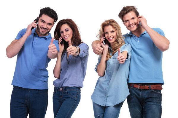 Group of people making the ok sign on the phone