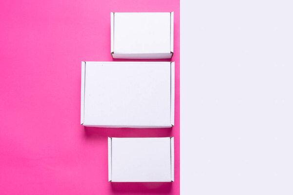 Set, lot of white cardboard box on color background, top view