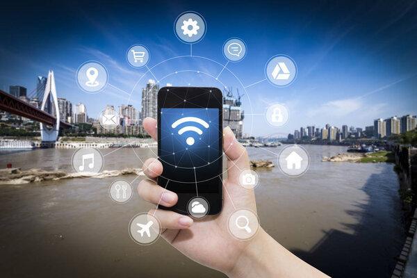 smart phone in hand and using internet wifi network connection c