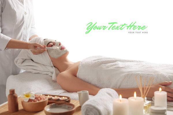 Cosmetologist applying mask on woman's face. Spa salon advertising, space for design