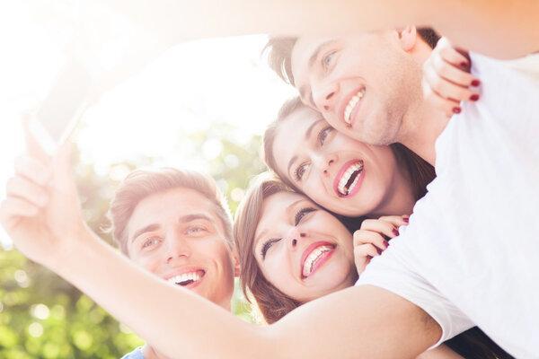 Friends taking photo of themselves