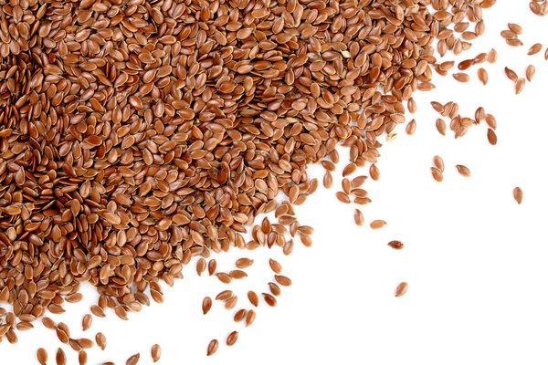 flax seeds isolated on white background with copy space for your text. Top view