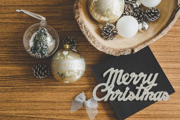 Christmas concept with Christmas decorations on wood background.