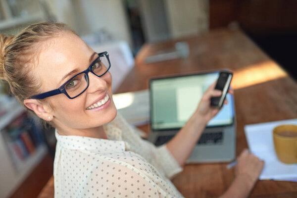 Portrait, freelancer or laptop on phone to scroll, text or typing on social media, or news app. Happy, female writer or smartphone as searching, post or reading blog on internet in remote work.