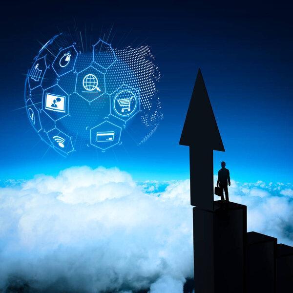 E-commerce concept with VR digital interface with icons of shopping cart and delivery truck and credit card with symbol of online purchase on internet.businessman stands successfully on building top Looking Towards