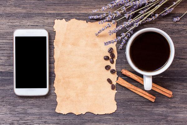Old paper on dark wooden table background.