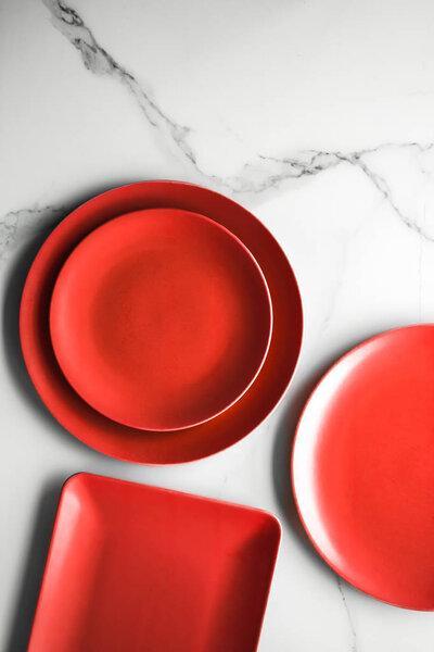 empty red plate on marble - recipe and restaurant mockup flatlay styled concept