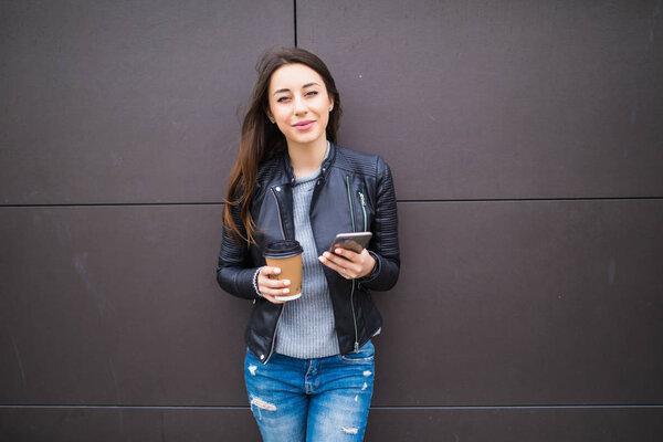Attractive young woman using smart phone. Coffee break