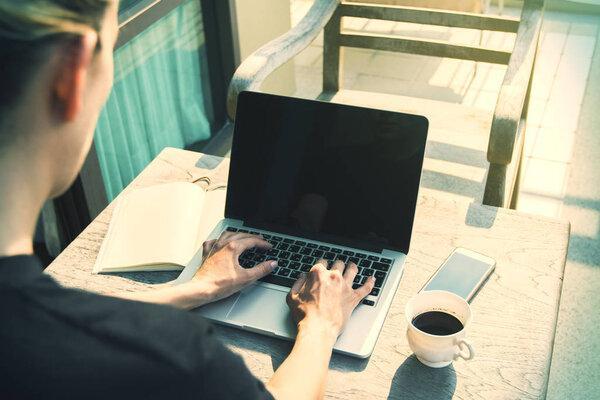 European girl using laptop toning