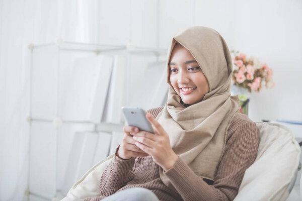 happy asian woman using mobile phone