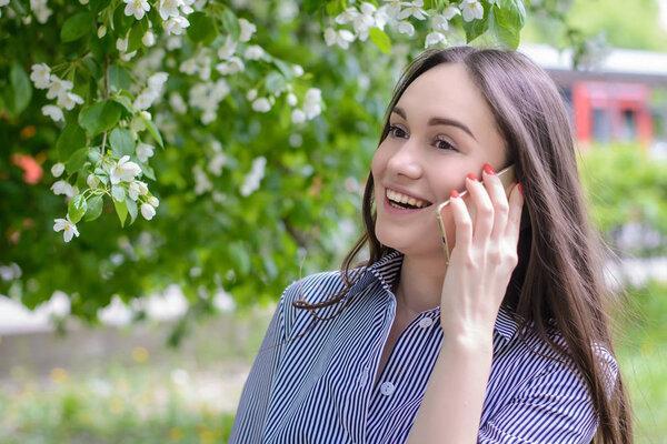 Beautiful girl speaks by phone