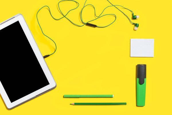 business accessories on a yellow surface