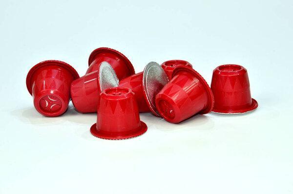 Collection of espresso coffee capsules red isolated on white background, Closeup view with details.