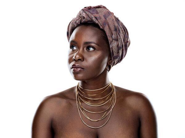 Beauty, tradition and black woman in studio with wrap, inspiration and natural glow on mockup. Pride, confidence and African girl with fashion culture, unique identity and scarf on white background.
