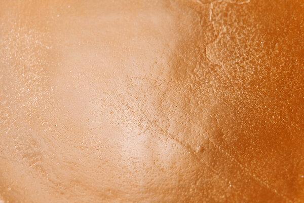 Festive Matte gold wallpaper.Golden relief texture.New Year and Christmas Wallpaper.Gold mockup with text space 