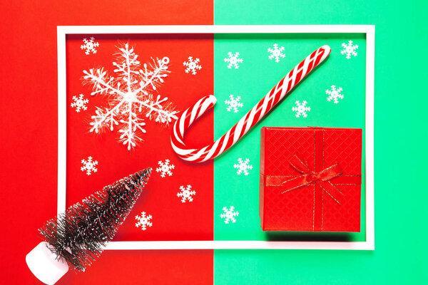 Chrismas composition with present box, decorative fir tree, loll