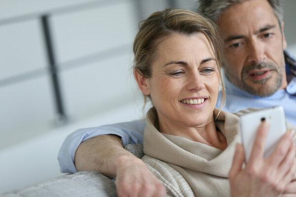 Couple using smartphone