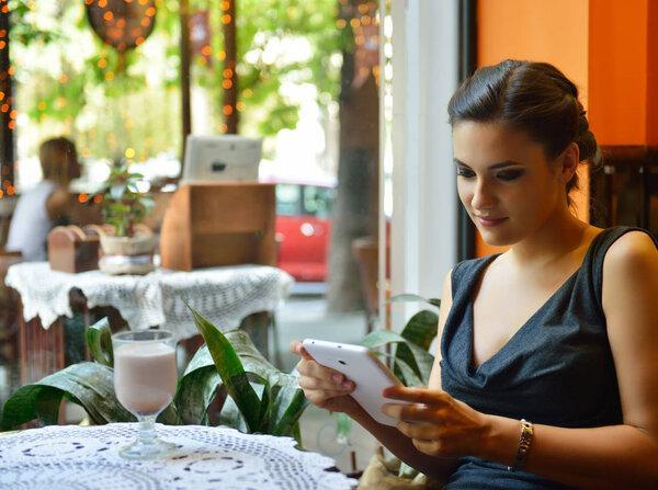  woman holding digital table