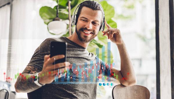 Successful of business trader investor man use technology smartphone trading graph of block chain stock market cryptocurrency investment selling and buy with price chart data graph