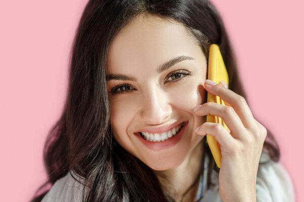 Young pretty woman speaking on the phone