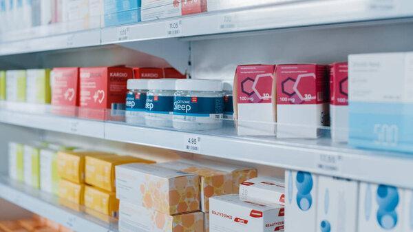 Modern Pharmacy Drugstore with Shelves full of Packages with Modern Medicine, Pill Drugs, Boxes with Vitamins and Supplements, Health Care and Beauty Products.