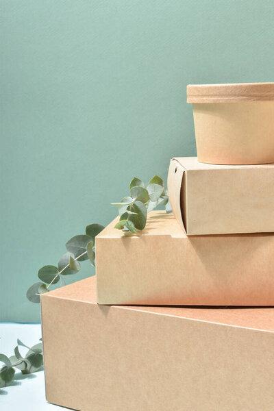 Paper packaging on a neutral background. Food delivery, takeaway. Environmental protection. Zero waste. Flat layout, top view, place to copy.
