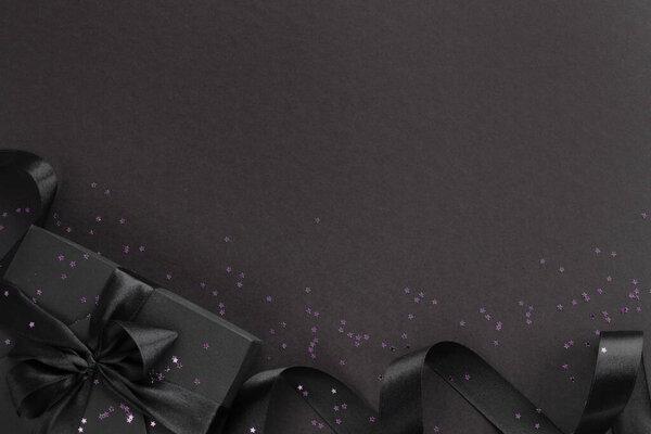 Black friday gift on dark background